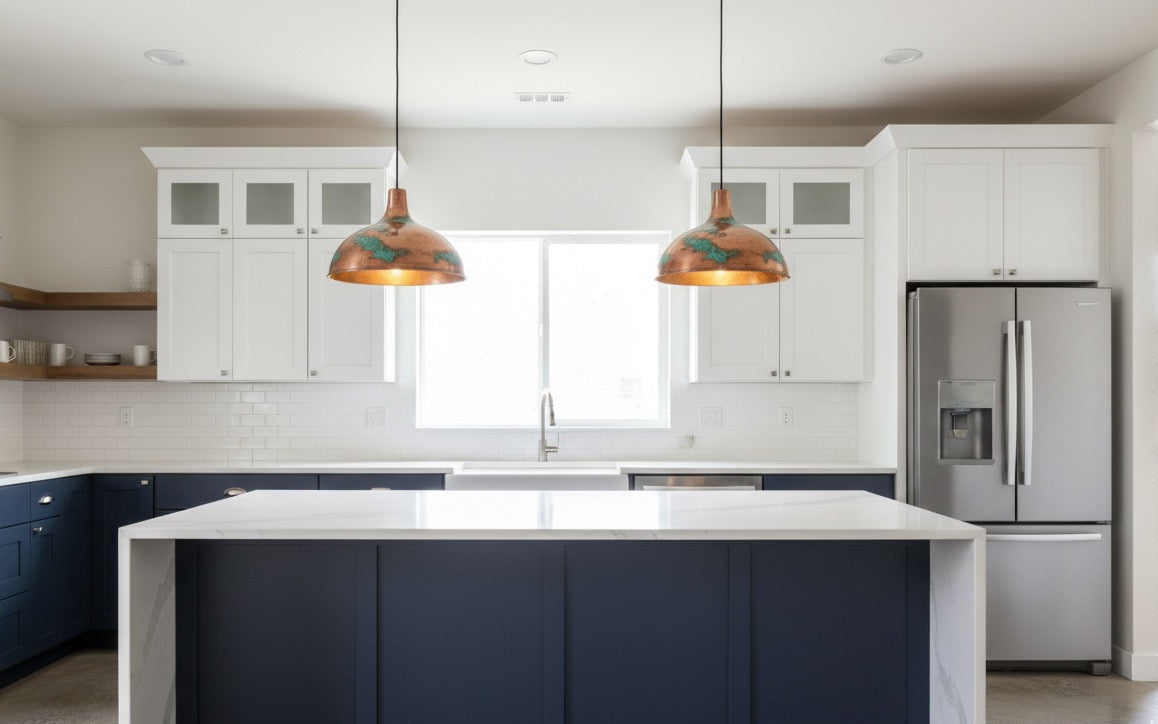 Modern kitchen with white cabinets, a blue island, and stainless steel appliances.