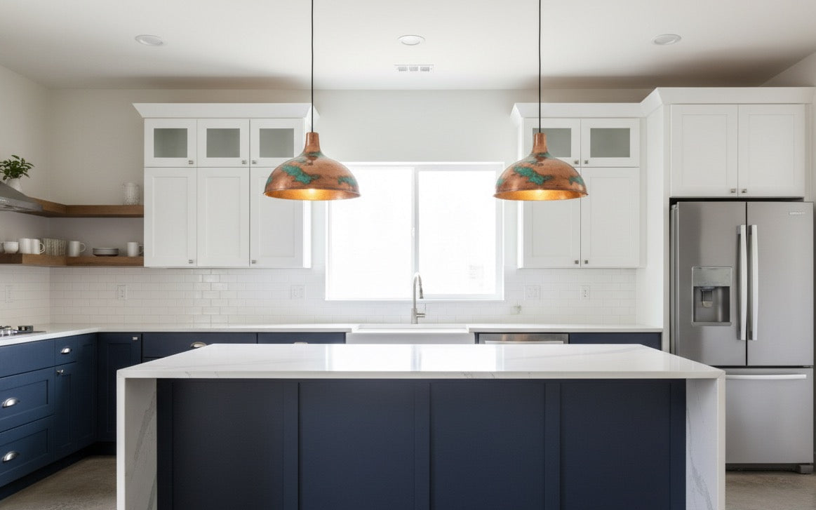 Modern kitchen with white cabinets, a blue island, and stainless steel appliances.