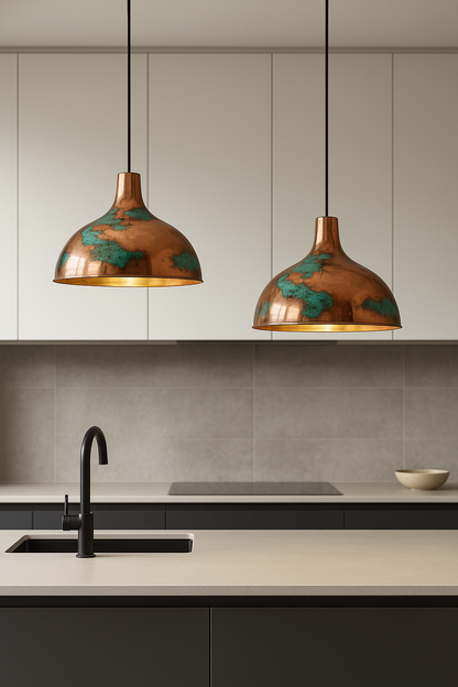Modern kitchen with pendant lights hanging above a countertop.
