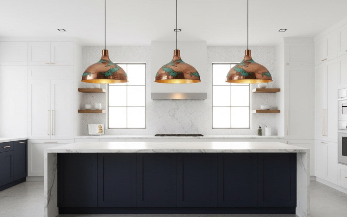 Modern kitchen with black island, white countertops, and pendant lights.