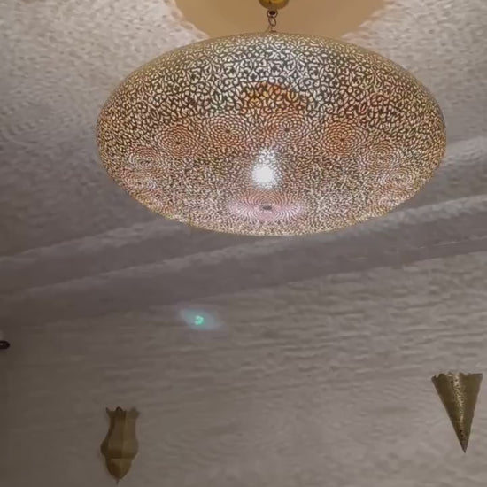 Handmade Moroccan brass flush mount ceiling light with intricate pierced pattern.