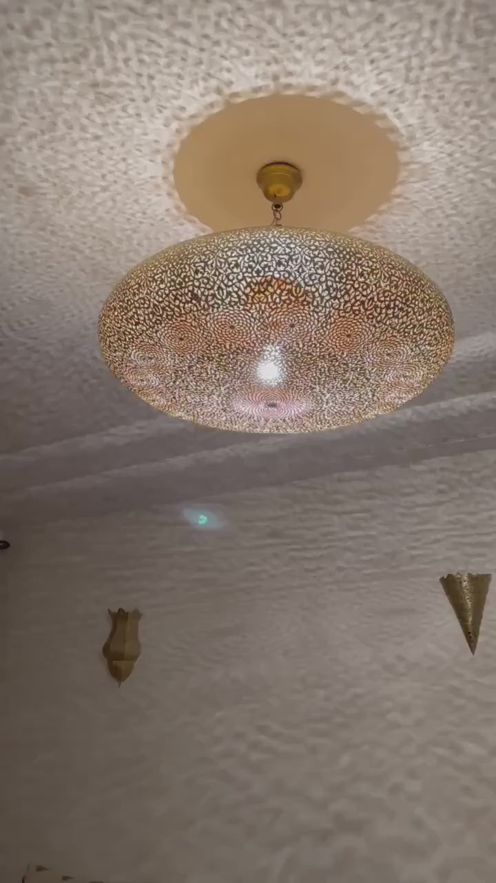 Handmade Moroccan brass flush mount ceiling light with intricate pierced pattern.